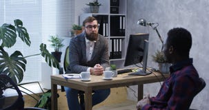 Psychologist talking to young man stock photos Psychologist talking to young man stock photos