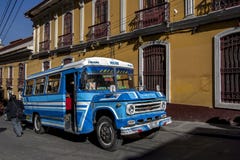 A public bus driving through the old town in La Paz in Bolivia. Royalty Free Stock Image A public bus driving through the old town in La Paz in Bolivia. Royalty Free Stock Image
