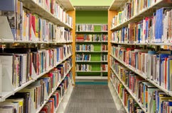 Public library. Interior of a public library showing hundreds of books on shelves Public library. Interior of a public library showing hundreds of books on shelves