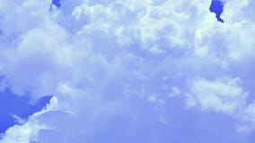 Puffy smoke white cumulonimbus cumulus clouds formation in blue sky 4k timelapse