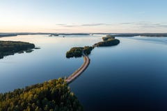 Pulkkilanharju ridge road and calm Päijänne lake in summer in Finland