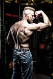 Pumped shirtless man in jeans at the gym royalty free stock photos Pumped shirtless man in jeans at the gym royalty free stock photos