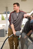 Pumping Gas At The Gas Station Stock Photos