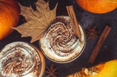 Pumpkin Latte Drink. Autumn Coffee With Spicy Pumpkin Flavor And Cream On A Dark Background. Seasonal Fall Drinks For Halloween Stock Image