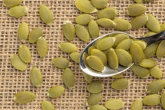 Pumpkin seeds or pips on a dessert spoon royalty free stock images Pumpkin seeds or pips on a dessert spoon royalty free stock images