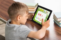 Pupil Solving Math Problem On Digital Tablet royalty free stock image Pupil Solving Math Problem On Digital Tablet royalty free stock image