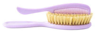 Purple brush and comb isolated on white Stock Photo Purple brush and comb isolated on white Stock Photo