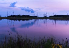 Purple cloud hovering over smooth water royalty free stock photography Purple cloud hovering over smooth water royalty free stock photography