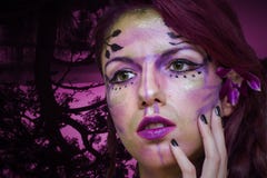Purple fairy. Make up with a forest background Purple fairy. Make up with a forest background
