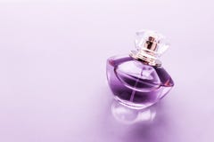Purple Perfume Bottle On Glossy Background, Sweet Floral Scent, Glamour Fragrance And Eau De Parfum As Holiday Gift And Luxury Stock Image