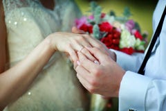 Putting A Ring On The Hand Stock Photography