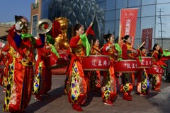 Puyang, Henan Province, China: The performance of `Battle Drum` by the women`s gongs and drums team of Shuixiu Celebration, in whi stock image Puyang, Henan Province, China: The performance of `Battle Drum` by the women`s gongs and drums team of Shuixiu Celebration, in whi stock image
