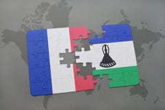 puzzle with the national flag of france and lesotho on a world map background. Stock Images puzzle with the national flag of france and lesotho on a world map background. Stock Images