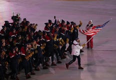 Olympic champion Erin Hamlin carrying the United States flag leading the team USA the PyeongChang 2018 Olympics opening ceremony royalty free stock image Olympic champion Erin Hamlin carrying the United States flag leading the team USA the PyeongChang 2018 Olympics opening ceremony royalty free stock image