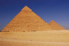 Pyramids of Egypt. Pyramids of Giza in Egypt against a blue sky Pyramids of Egypt. Pyramids of Giza in Egypt against a blue sky