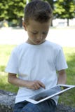 Pys med PCtableten arkivfoto Pys med PCtableten arkivfoto