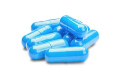 Píldoras azules de la medicina en fondo blanco aislado Foto de archivo libre de regalías Píldoras azules de la medicina en fondo blanco aislado Foto de archivo libre de regalías