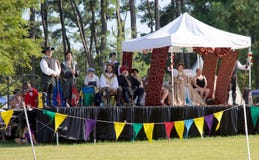 The Queen's court on stage at the Inaugural Mid-South Renaissance Faire. stock image The Queen's court on stage at the Inaugural Mid-South Renaissance Faire. stock image
