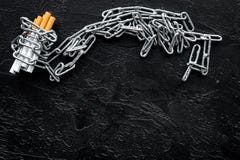 Quit smoking. Cigarettes in chains on black background top view space for text royalty free stock photos Quit smoking. Cigarettes in chains on black background top view space for text royalty free stock photos