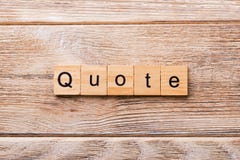 Quote word written on wood block. Quote text on wooden table for your desing, concept royalty free stock images Quote word written on wood block. Quote text on wooden table for your desing, concept royalty free stock images