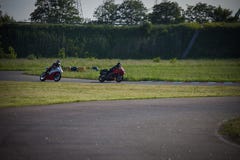 Race between two motorcycle athletes royalty free stock photography Race between two motorcycle athletes royalty free stock photography