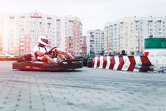 Racing car on the track in action, championship, active sports, extreme fun, the driver keeps his hands on the wheel. protective stock photo Racing car on the track in action, championship, active sports, extreme fun, the driver keeps his hands on the wheel. protective stock photo