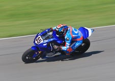 Racing motorcyclist on the curve royalty free stock photo Racing motorcyclist on the curve royalty free stock photo