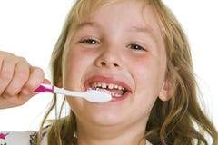 Ragazza sveglia che pulisce i suoi denti. Immagine Stock Libera da Diritti Ragazza sveglia che pulisce i suoi denti. Immagine Stock Libera da Diritti