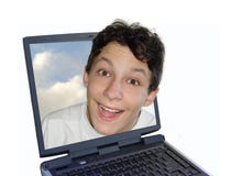 Ragazzo felice in computer portatile Ragazzo felice in computer portatile