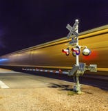 Railroad Crossing With Passing Train By Night Stock Images Railroad Crossing With Passing Train By Night Stock Images