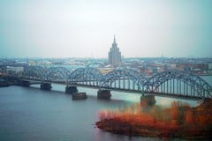 Railway bridge with the city of Riga as background stock photos Railway bridge with the city of Riga as background stock photos