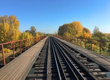 Railway bridge over the river under the blue sky stock photo Railway bridge over the river under the blue sky stock photo