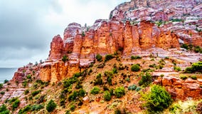 Rain pouring down on the geological formations of the red sandstone buttes surrounding the Chapel of the Holy Cross at Sedona stock photo Rain pouring down on the geological formations of the red sandstone buttes surrounding the Chapel of the Holy Cross at Sedona stock photo