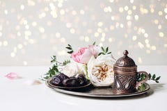 Ramadan Kareem greeting card, invitation. Iftar dinner. Muslim Eid ul Adha banner. Plate with dates fruit, bronze coffee