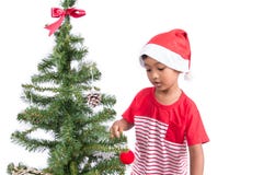Rapaz pequeno com decoração da árvore de Natal Imagens de Stock Rapaz pequeno com decoração da árvore de Natal Imagens de Stock