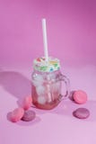 Raspberry lemonade and macaroons on a pink background. royalty free stock photography Raspberry lemonade and macaroons on a pink background. royalty free stock photography