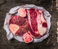 raw Meat with bones for soup or broth in white paper royalty free stock photo raw Meat with bones for soup or broth in white paper royalty free stock photo