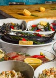 Raw fish, lemons, greens are in bowls. Ingredients for cooking royalty free stock photos Raw fish, lemons, greens are in bowls. Ingredients for cooking royalty free stock photos