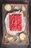 Raw ground beef on wooden table with Spices and onion stock images Raw ground beef on wooden table with Spices and onion stock images