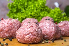 Raw mince patties in a cooking . cutlets are prepared for cutting board royalty free stock photography Raw mince patties in a cooking . cutlets are prepared for cutting board royalty free stock photography