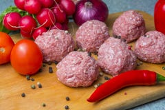 Raw mince patties in a cooking . cutlets are prepared for cutting board royalty free stock photos Raw mince patties in a cooking . cutlets are prepared for cutting board royalty free stock photos