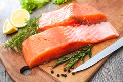 Raw salmon fish fillet with fresh herbs royalty free stock photography Raw salmon fish fillet with fresh herbs royalty free stock photography