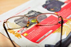 Reading newspaper advertizing, search for discount royalty free stock image Reading newspaper advertizing, search for discount royalty free stock image