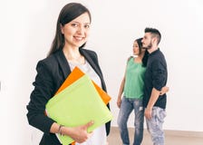 Real estate agent with customers stock photography Real estate agent with customers stock photography