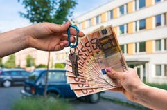 Real Estate Agent Giving House Keys To A New Property Owner, Who Stock Images Real Estate Agent Giving House Keys To A New Property Owner, Who Stock Images