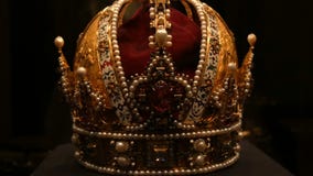 Real old vintage antique royal crown for official coronations, decorated with gold, diamonds, rubies, sapphires and