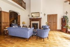 Real photo of a blue set of sofa and chairs in an elegant living stock photos Real photo of a blue set of sofa and chairs in an elegant living stock photos
