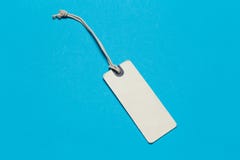 Real Tag With String On blue Paper stock image Real Tag With String On blue Paper stock image