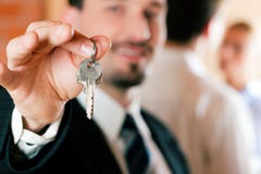 Realtor In Apartment Giving Keys To Couple Stock Photos Realtor In Apartment Giving Keys To Couple Stock Photos