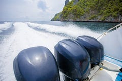 rear view of speed boat running over sea water for traveling destination stock photo rear view of speed boat running over sea water for traveling destination stock photo